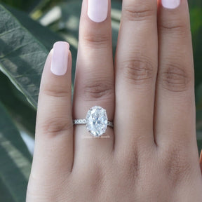 Close-Up View of Oval And Round Cut Moissanite Engagement Ring In White Gold