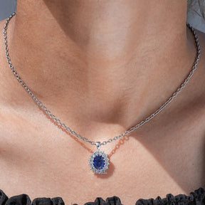 View of lab grown gemestone oval cut halo pendant 