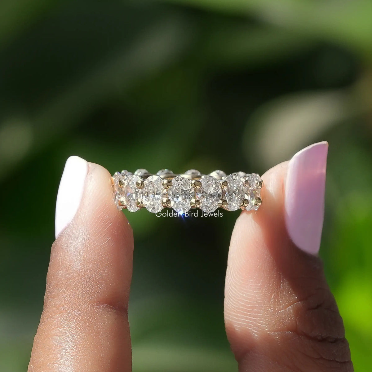 Front View of Oval Cut Diamond Eternity Wedding Band In two Fingers