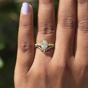 Detailed View Of Oval And Round Cut Moissanite Ring In Yellow Gold