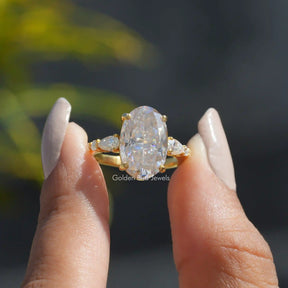 Front View of Oval Cut Moissanite Engagement Ring In two Fingers
