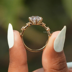 Back View of Oval And Round Cut Moissanite Ring In two fingers