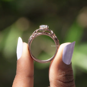 Back View of Oval Cut Moissanite Wedding Ring In two fingers
