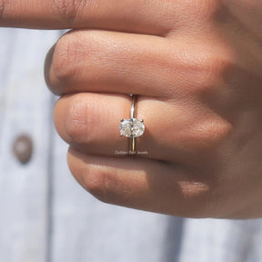 View of Oval Cut Hidden Halo Ring In Yellow Gold