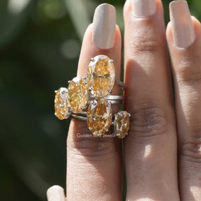 Front View of Moissanite Oval Cut Solitaire Engagement Rings In Finger
