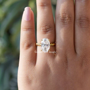 Close-Up View of Moissanite Oval Cut Solitaire Ring In Yellow Gold