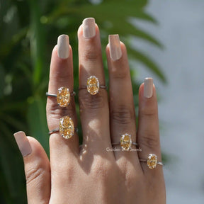 Solitaire Oval Cut Moissanite Ring In Fingers
