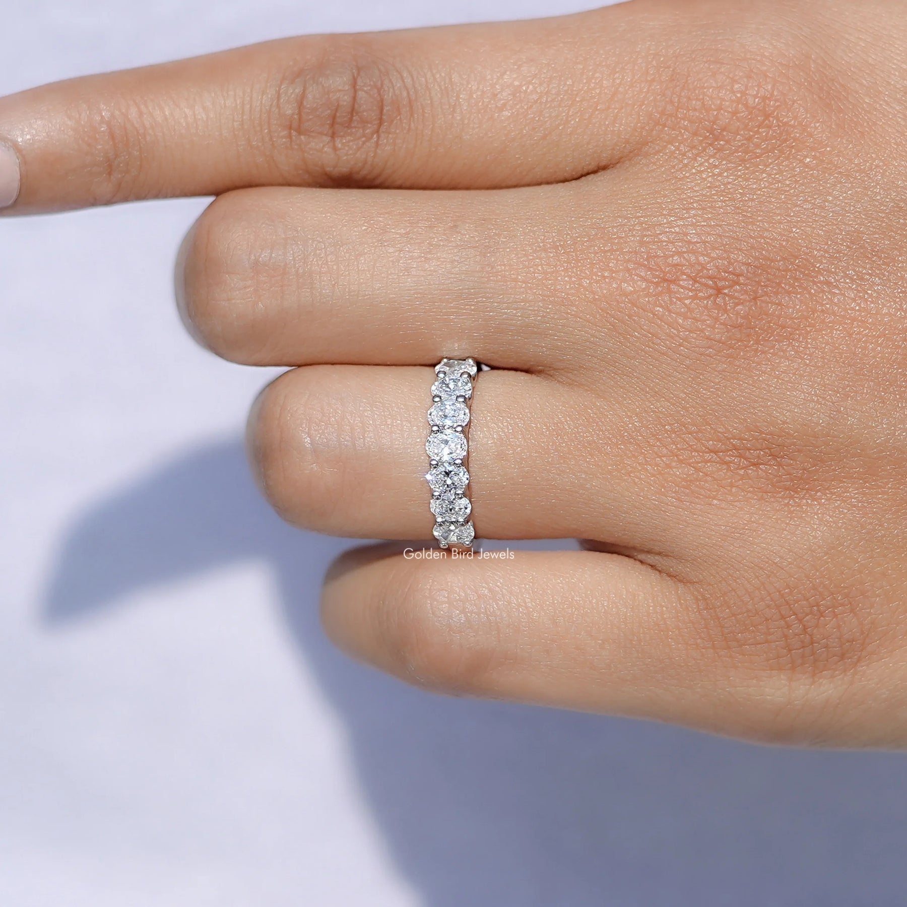 View of Oval Seven Stone Wedding Band in prongs setting 