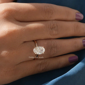 View of Moissanite Oval Cut Solitaire Ring In Yellow Gold