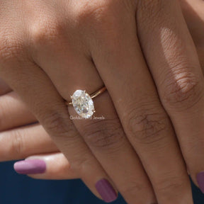 Close-Up View of Oval Cut Moissanite Ring In Yellow Gold