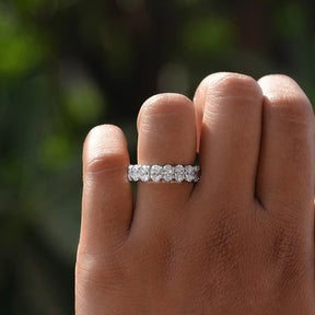 View of Oval Cut Lab Grown Wedding Band In Finger