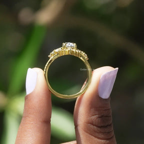 Back View of Oval Cut Moissanite Accent Stone Ring In two fingers