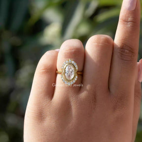 Oval Cut Halo Ring With Round Cut Side Stones In finger