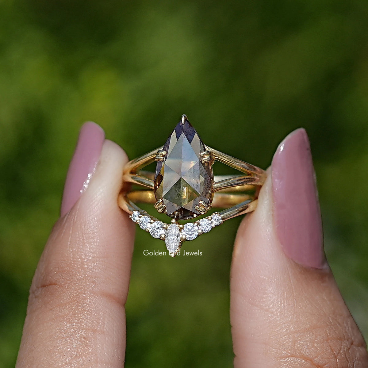 Bridal ring set with pear-cut moissanite and pavé accent band