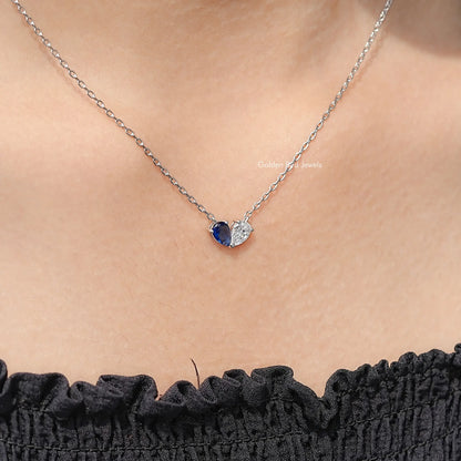 Sterling silver two-stone pendant necklace, pear-cut blue stone with clear accent