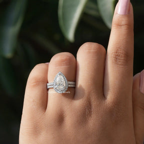 In finger view of Moissanite pear cut bridal ring set in white gold 