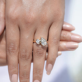 In finger front view of Pear Cut Lab Diamond Ring in unique shape