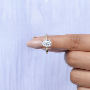 In finger front View of Pear Cut Lab Grown Diamond Solitaire Ring In Yellow Gold