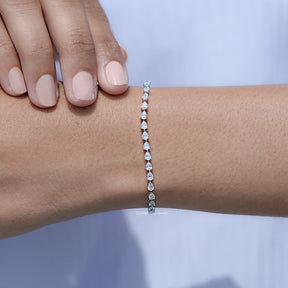 In hand Showing View Pear Cut Diamond Tennis Steel Bracelet
