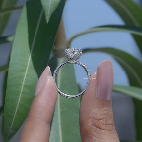 Back View of Pear Shaped Moissanite Ring In two fingers