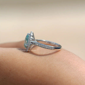View of A Blue Pear Cut Moissanite Ring Made In 18k White Gold