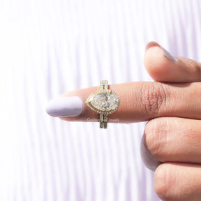 In finger front View of Pear Cut Moissanite Halo Ring