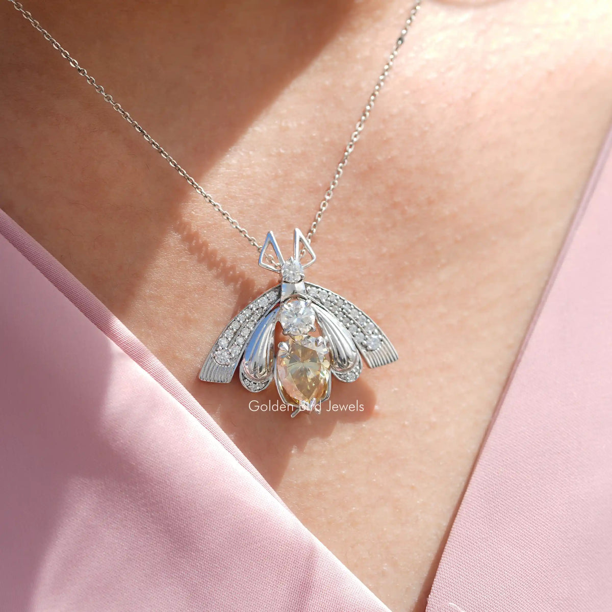 In neck view of Pear cut statement moissanite halo pendant 