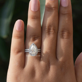 In finger front view of pear shape moissanite bridal ring 