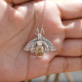 Full view of moissanite pendant in unique shape 
