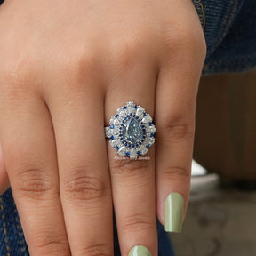 View of Moissanite Blue Pear Halo Ring In White Gold