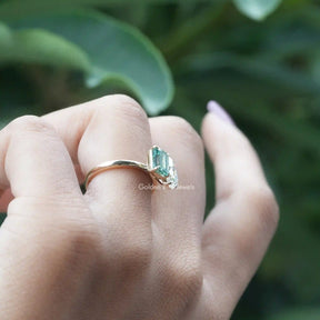 In finger side viewof emerald cut ring