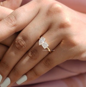 Detailed View Of Pear and Princess Cut Moissanite Toi Et Moi Ring In Yellow Gold