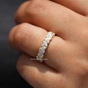 In finger front view of Marquise And Round Cut Moissanite engagement ring 