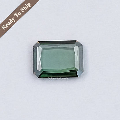 Emerald-cut green moissanite loose gemstone with faceted octagon shape