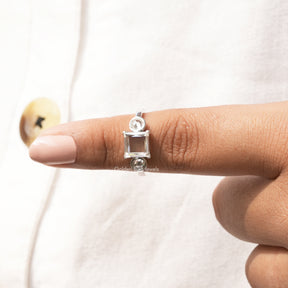 In finger front View of Three Stone Portrait Cut Princess Moissanite Ring In White Gold