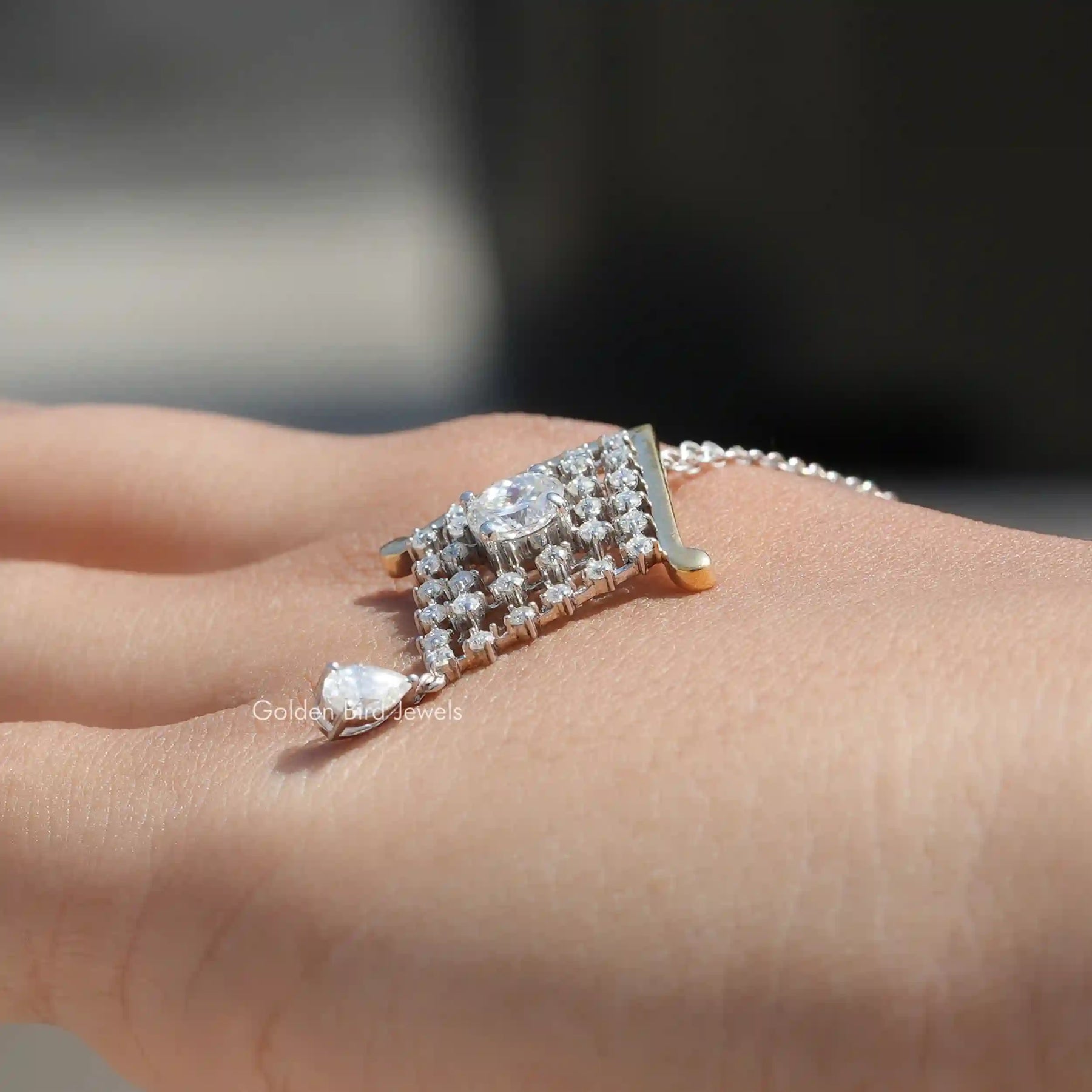 Side view of Portuguese cut moissanite statement pendant