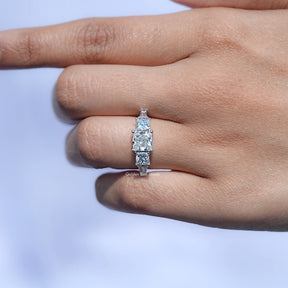In finger View of Princess And Tapered Baguette Cut Five Stone Ring In White Gold
