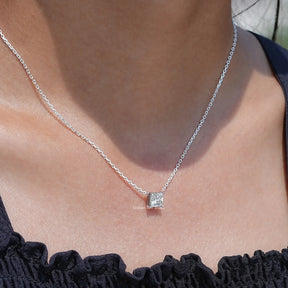 In neck view of Princess cut diamond halo pendant 