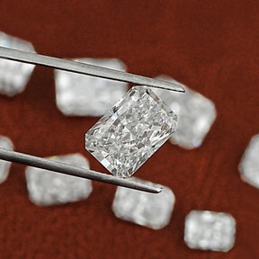 Twijer holding On the Radiant Cut Loose Diamond
