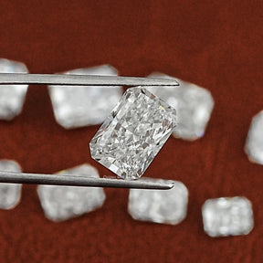 Twijer holding On the Radiant Cut Loose Lab Diamond