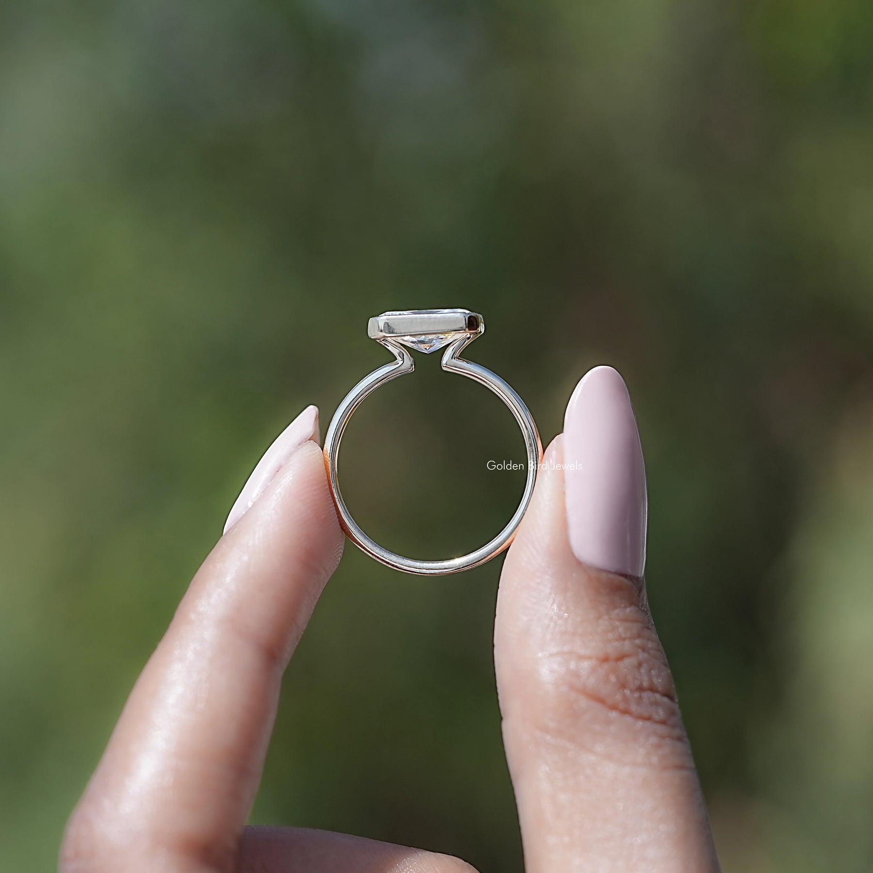 Back view of Radiant Cut Moissanite Solitaire Ring in secure setting 