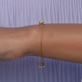 Side view of lab Radiant Cut Bracelet In yellow Gold
