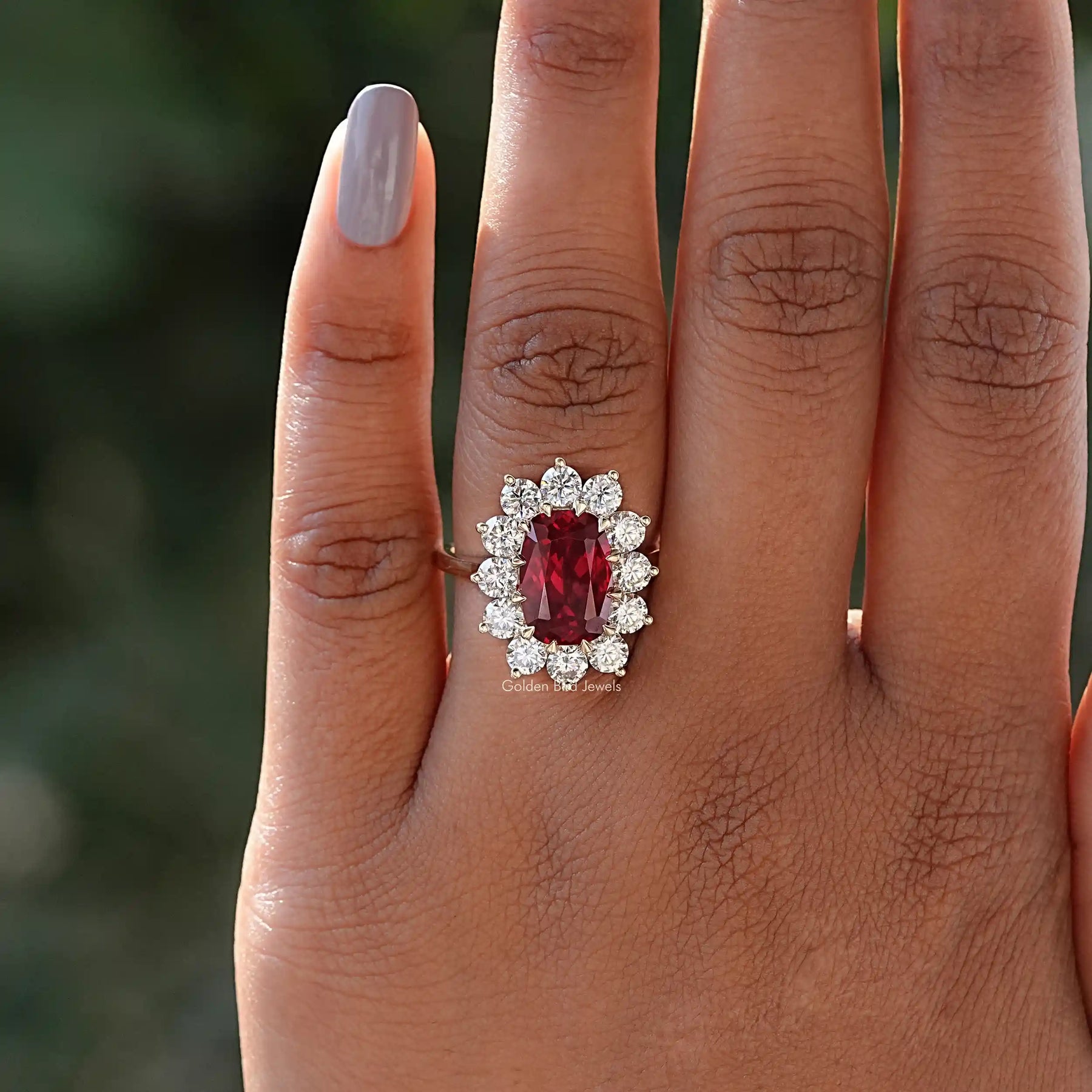 In finger front View of Cushion Cut Halo Ring In Yellow Gold