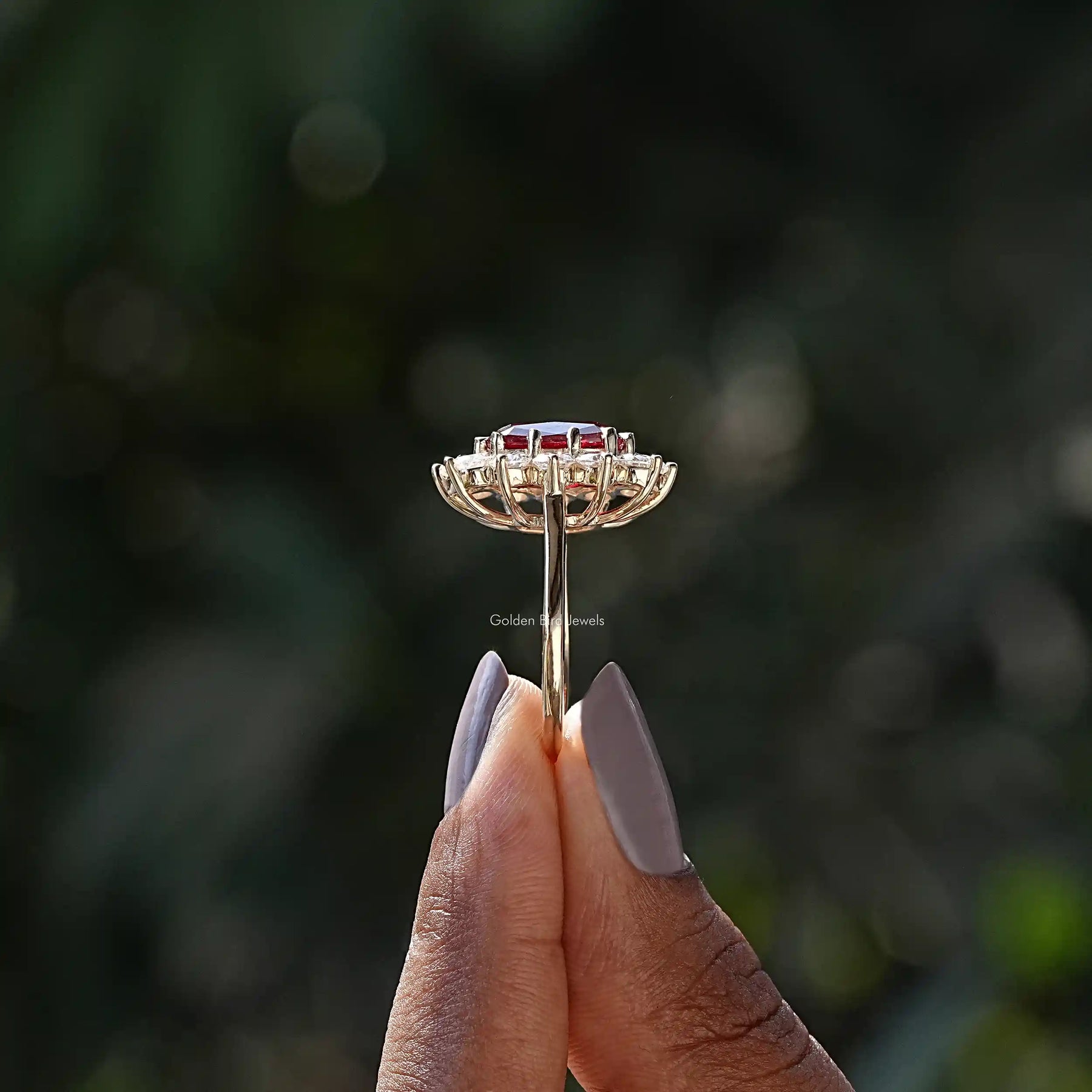 Side View of Cushion Cut And Round Cut Halo Ring In two fingers