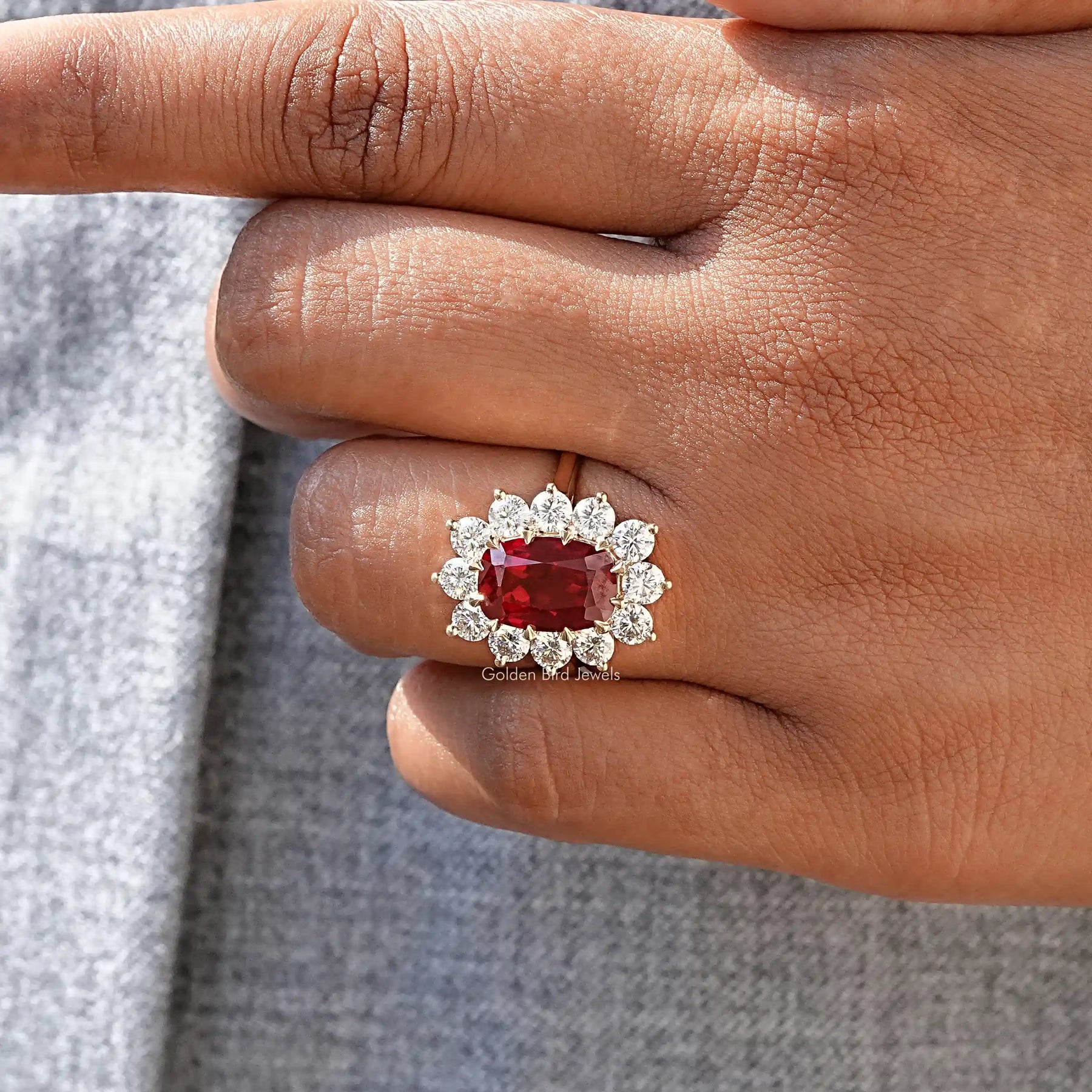 Close-Up View of Red Ruby Cushion Cut Gemstone Ring In Yellow Gold