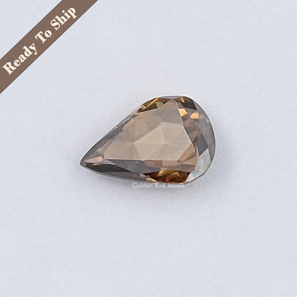Pear-shaped rose-cut moissanite gemstone, faceted teardrop in champagne tones