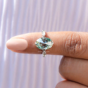 Rose oval cut moissanite ring with elegant accent detailing.