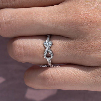 Round-cut stone hope ring with X-style centerpiece on a silver band