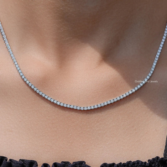 Lab-grown diamond tennis necklace with round-cut stones in a curved U shape