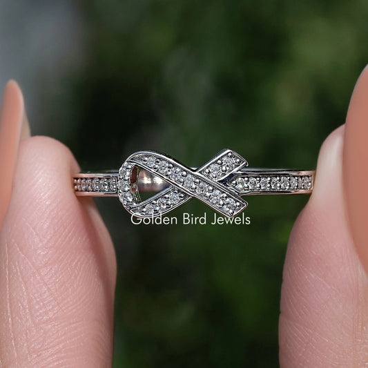 Silver hope ring with round-cut stones and cross-style design
